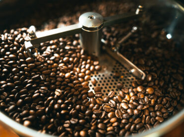 Roasted coffee beans in the machine at a coffee shop